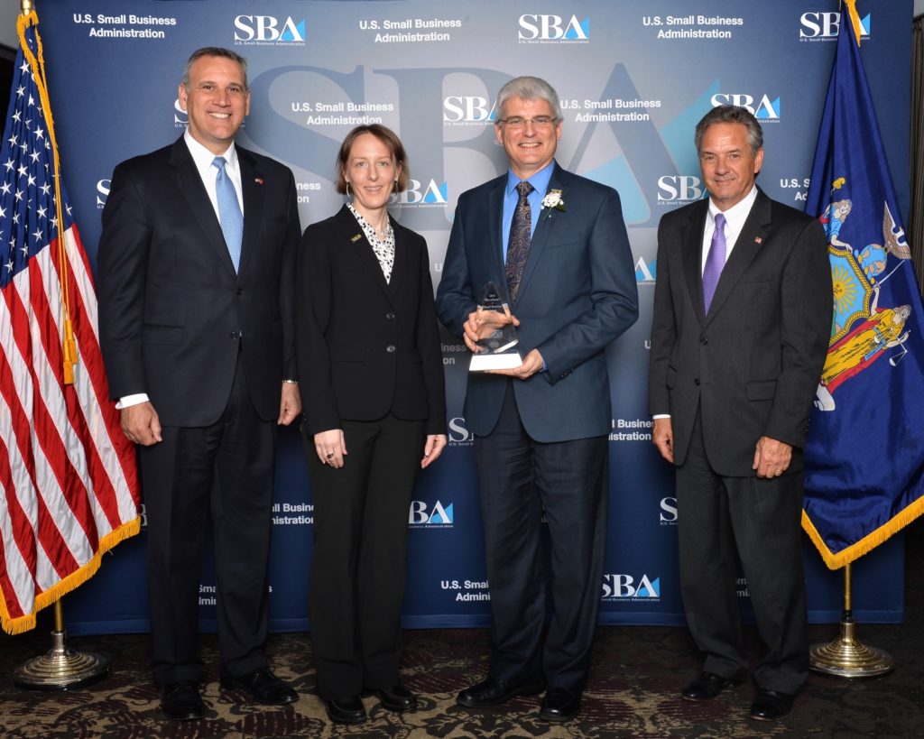 Photo from the Small Business Excellence Awards luncheon on May 6, 2016. From left to right: Patrick MacKrell, NYBDC President & CEO | Karen Livingston, SBDC Onondaga Business Counselor | Christopher Resig, N.K. BHANDARI, President | B.J. Paprocki, SBA Syracuse, District Director